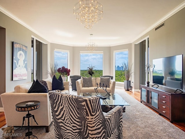 5051 Pelican Colony Blvd Unit 301, Bonita Springs, FL 34134 - living room featuring ornamental molding, wood finished floors, a notable chandelier, and visible vents