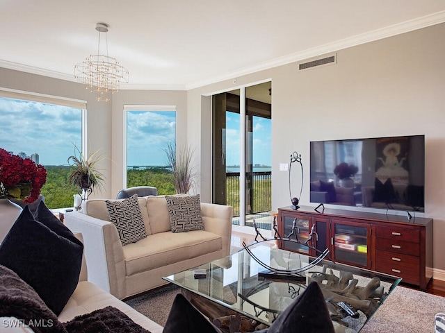5051 Pelican Colony Blvd Unit 301, Bonita Springs, FL 34134 - living room featuring a notable chandelier, crown molding, visible vents, and wood finished floors