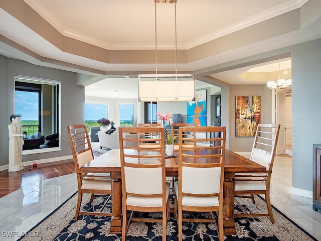 5051 Pelican Colony Blvd Unit 301, Bonita Springs, FL 34134 - dining space featuring baseboards, a notable chandelier, ornamental molding, and a raised ceiling