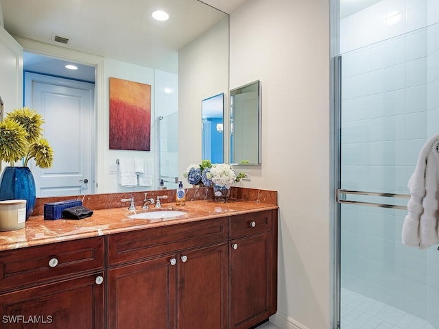 5051 Pelican Colony Blvd Unit 301, Bonita Springs, FL 34134 - bathroom featuring visible vents, a shower stall, baseboards, recessed lighting, and vanity