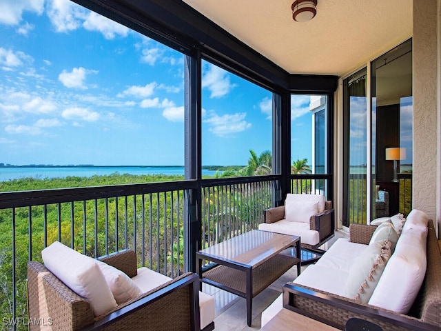 5051 Pelican Colony Blvd Unit 301, Bonita Springs, FL 34134 - sunroom / solarium with a water view and an outdoor living space
