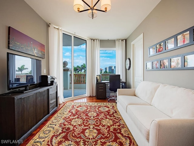 5051 Pelican Colony Blvd Unit 301, Bonita Springs, FL 34134 - living room featuring dark wood-style floors, a chandelier, and a wall of windows