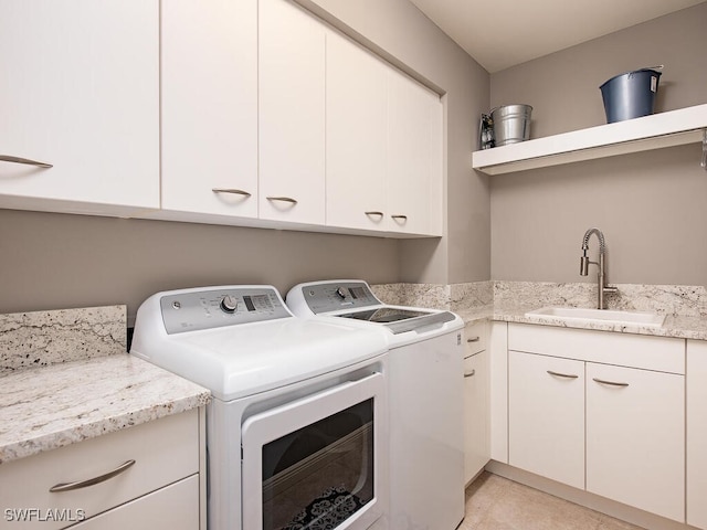5051 Pelican Colony Blvd Unit 301, Bonita Springs, FL 34134 - clothes washing area featuring light tile patterned flooring, washing machine and dryer, cabinet space, and a sink
