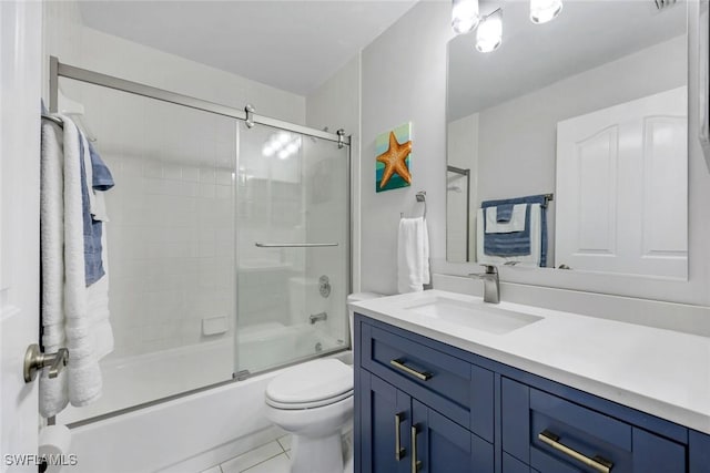 full bathroom with vanity, tile patterned floors, toilet, and shower / bath combination with glass door