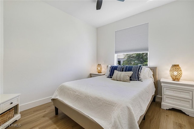 16451 Millstone Cir Unit 101, Fort Myers, FL 33908 - bedroom featuring light wood finished floors, ceiling fan, and baseboards