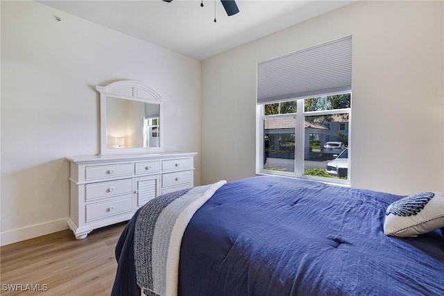 16451 Millstone Cir Unit 101, Fort Myers, FL 33908 - bedroom featuring light wood-type flooring, baseboards, and a ceiling fan