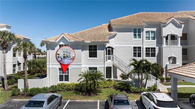 16451 Millstone Cir Unit 101, Fort Myers, FL 33908 - view of property featuring uncovered parking