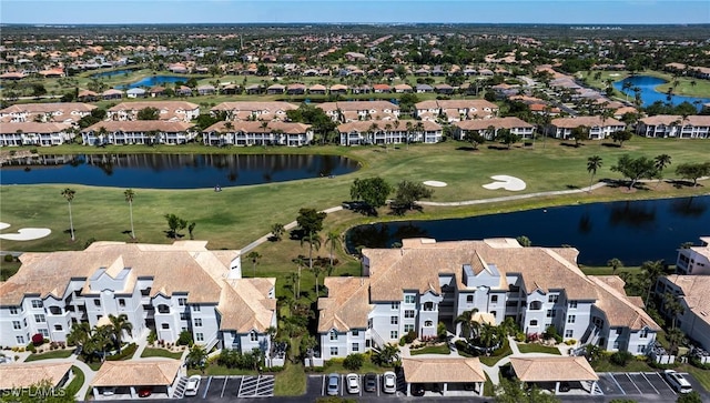 16451 Millstone Cir Unit 101, Fort Myers, FL 33908 - aerial view of property and surrounding area with a nearby body of water, a golf club, and nearby suburban area