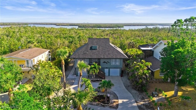 319 Nature View Ct, Fort Myers Beach, FL 33931 - view from above of property with a heavily wooded area and a large body of water