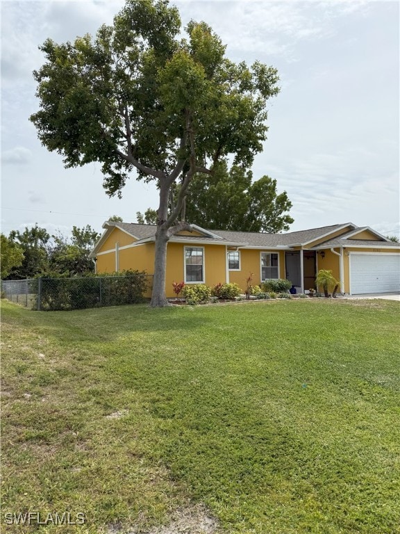 2303 NE 7th Ave, Cape Coral, FL 33909 - single story home with an attached garage, a front yard, and fence