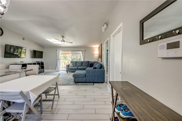 2303 NE 7th Ave, Cape Coral, FL 33909 - living area with lofted ceiling, visible vents, and ceiling fan