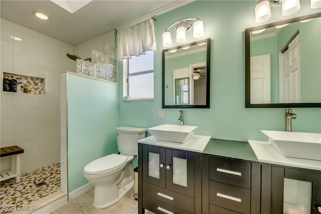 2303 NE 7th Ave, Cape Coral, FL 33909 - bathroom featuring toilet, a walk in shower, and a sink