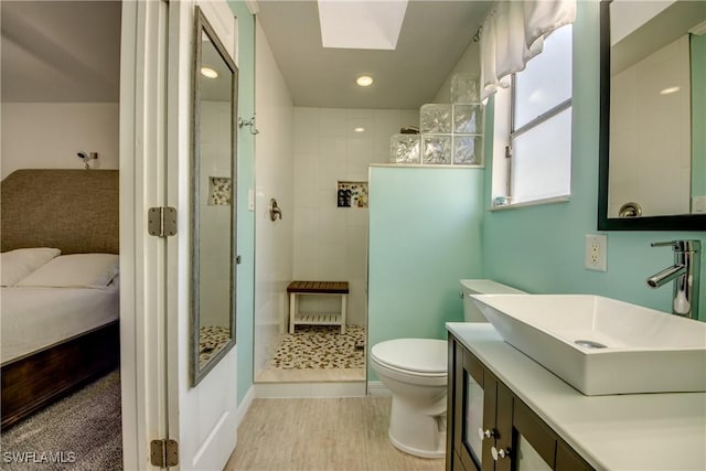 2303 NE 7th Ave, Cape Coral, FL 33909 - full bathroom with ensuite bathroom, a skylight, vanity, walk in shower, and toilet
