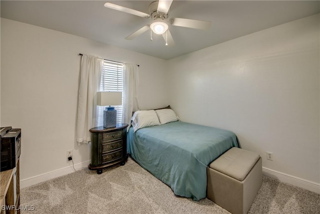 2303 NE 7th Ave, Cape Coral, FL 33909 - carpeted bedroom featuring a ceiling fan and baseboards