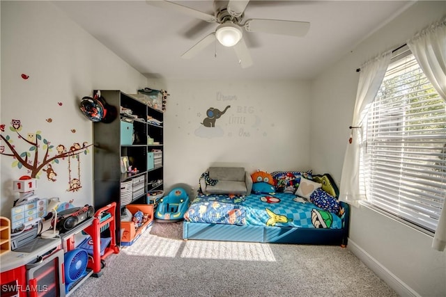 2303 NE 7th Ave, Cape Coral, FL 33909 - bedroom featuring a ceiling fan, baseboards, carpet, and multiple windows