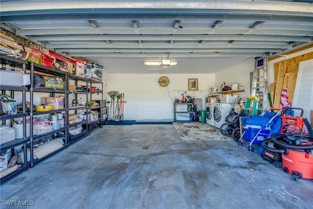 2303 NE 7th Ave, Cape Coral, FL 33909 - garage featuring washer and dryer and a garage door opener