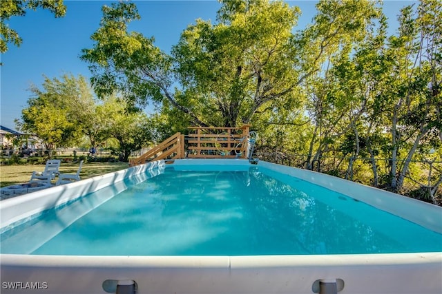 2303 NE 7th Ave, Cape Coral, FL 33909 - view of swimming pool featuring fence