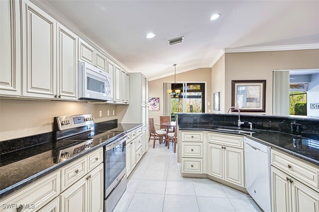 9078 Shadow Glen Way, Fort Myers, FL 33913 - kitchen with white appliances, a sink, ornamental molding, vaulted ceiling, and a chandelier
