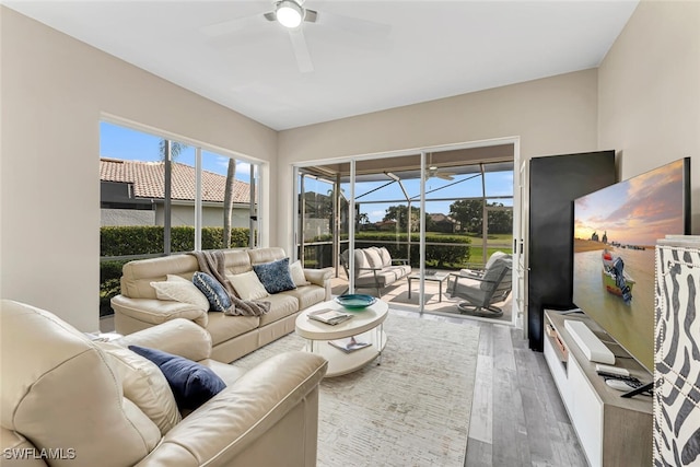 13471 Bridgeford Ave, Bonita Springs, FL 34135 - living area with wood finished floors, a sunroom, and ceiling fan
