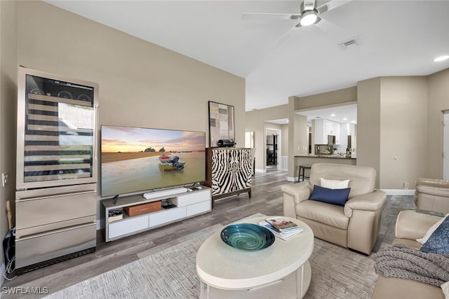 13471 Bridgeford Ave, Bonita Springs, FL 34135 - living room featuring baseboards, visible vents, a ceiling fan, and wood finished floors