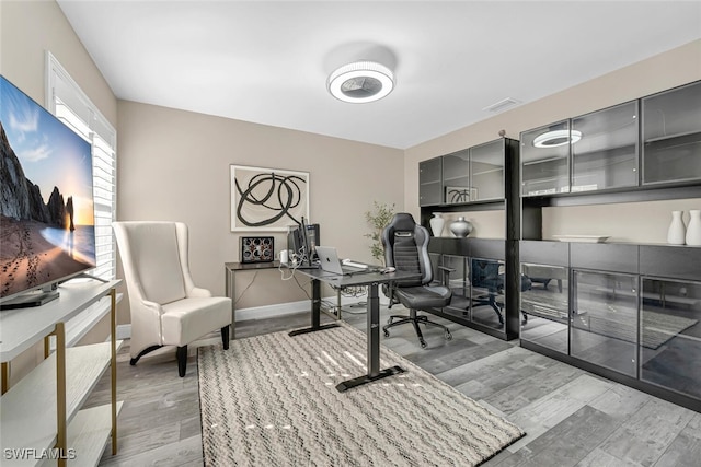 13471 Bridgeford Ave, Bonita Springs, FL 34135 - office space with baseboards, visible vents, and wood finished floors