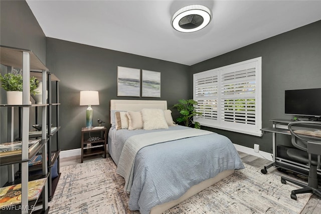 13471 Bridgeford Ave, Bonita Springs, FL 34135 - bedroom with baseboards and wood finished floors