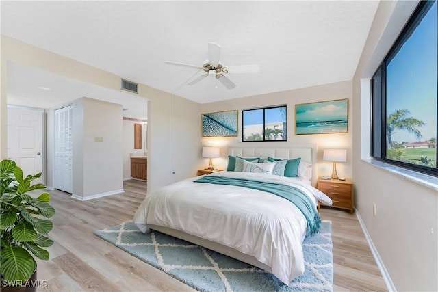 801 Islamorada Blvd Unit 21A, Punta Gorda, FL 33955 - bedroom featuring baseboards, light wood-type flooring, and multiple windows