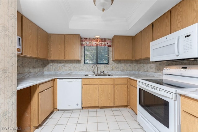801 Islamorada Blvd Unit 21A, Punta Gorda, FL 33955 - kitchen featuring white appliances, a sink, a raised ceiling, light countertops, and crown molding