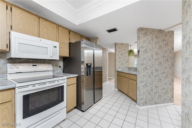 801 Islamorada Blvd Unit 21A, Punta Gorda, FL 33955 - kitchen featuring white appliances, light countertops, ornamental molding, backsplash, and light tile patterned floors