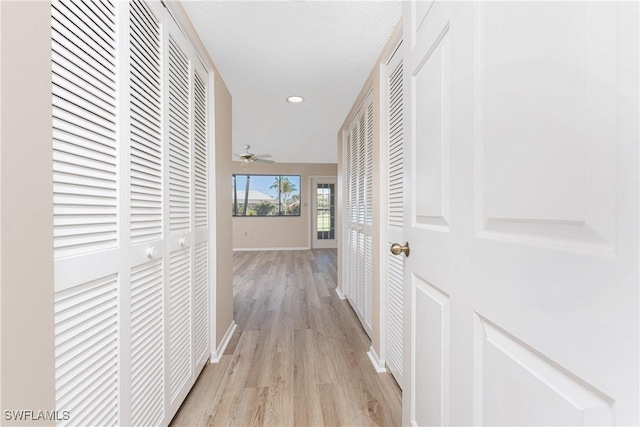 801 Islamorada Blvd Unit 21A, Punta Gorda, FL 33955 - hall featuring light wood-type flooring, baseboards, and recessed lighting