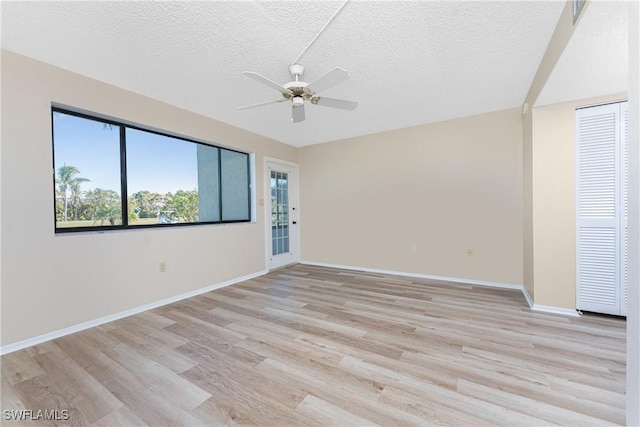 801 Islamorada Blvd Unit 21A, Punta Gorda, FL 33955 - spare room with ceiling fan, light wood finished floors, a textured ceiling, and baseboards