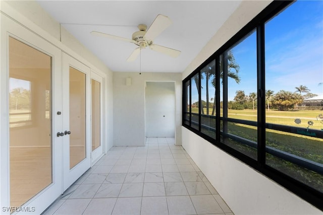 801 Islamorada Blvd Unit 21A, Punta Gorda, FL 33955 - unfurnished sunroom with french doors and marble look tiles