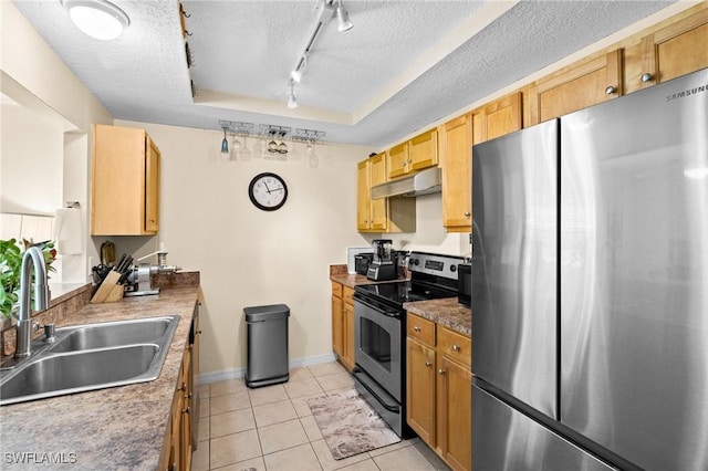 3322 N Key Dr Unit 1, North Fort Myers, FL 33903 - kitchen with appliances with stainless steel finishes, a sink, under cabinet range hood, rail lighting, and a textured ceiling