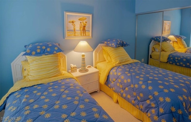 carpeted bedroom with a closet