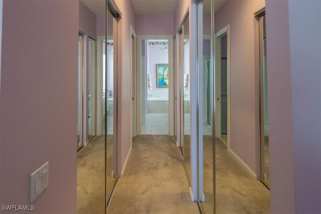 corridor with light colored carpet