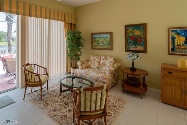 sitting room featuring light tile patterned floors and baseboards