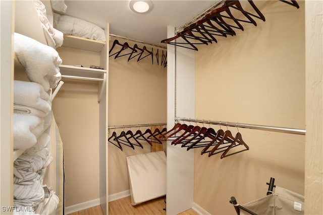spacious closet with wood finished floors