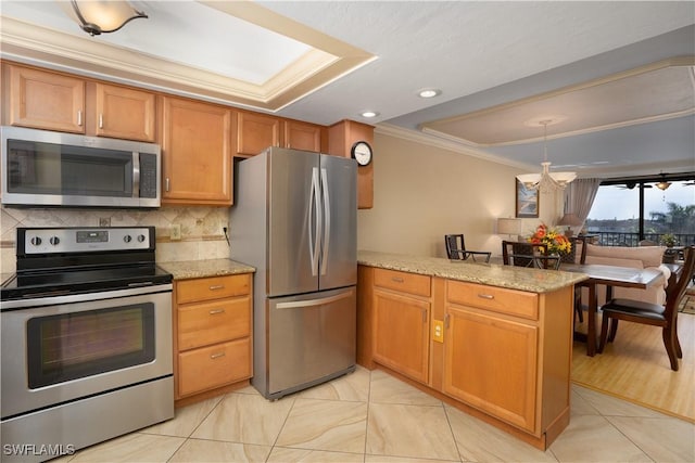 kitchen featuring tasteful backsplash, crown molding, a peninsula, a notable chandelier, and appliances with stainless steel finishes