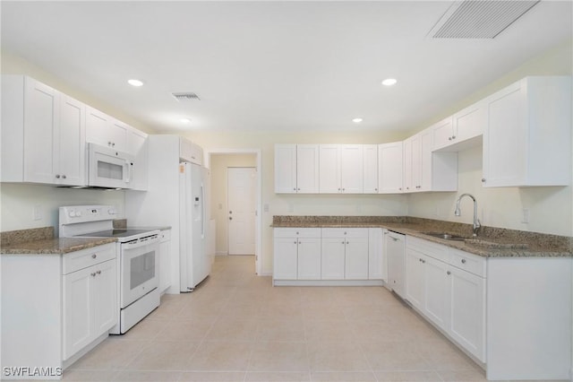 1861 Lillie St, Fort Myers, FL 33916 - kitchen featuring visible vents, stone countertops, and white appliances