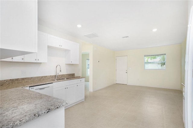 1861 Lillie St, Fort Myers, FL 33916 - kitchen featuring white dishwasher, light stone counters, a sink, and white cabinets
