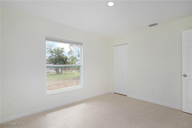 1861 Lillie St, Fort Myers, FL 33916 - spare room with light tile patterned flooring, baseboards, and visible vents