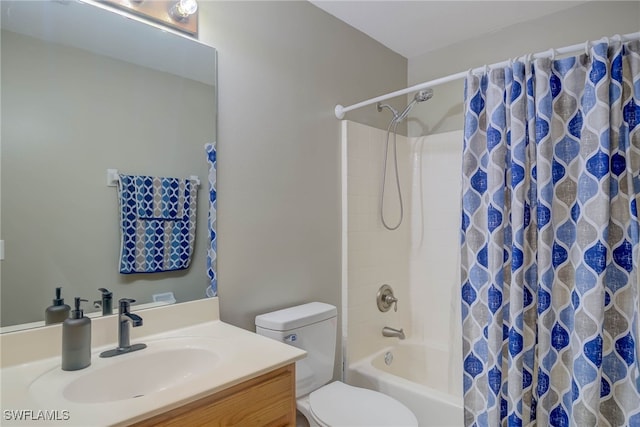bathroom with vanity, shower / bathtub combination with curtain, and toilet