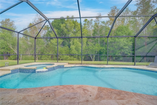 view of pool featuring a lanai and a pool with connected hot tub