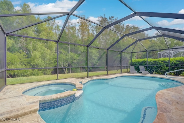 view of swimming pool with a pool with connected hot tub and a patio area