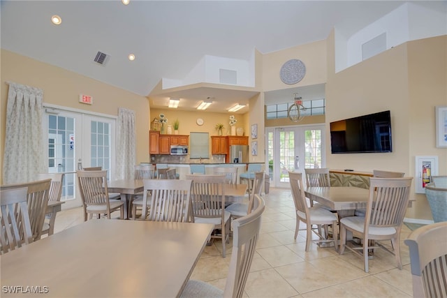 dining space featuring high vaulted ceiling, french doors, recessed lighting, light tile patterned floors, and visible vents