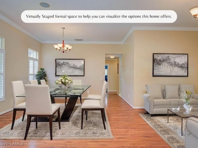 dining area with an inviting chandelier, light wood finished floors, crown molding, and baseboards