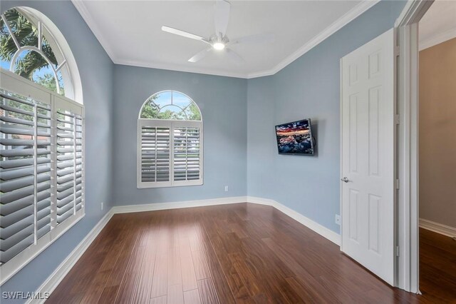 6044 Andros Way, Naples, FL 34119 - empty room featuring baseboards, crown molding, dark wood-type flooring, and a ceiling fan