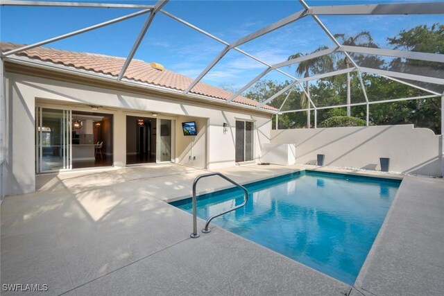6044 Andros Way, Naples, FL 34119 - view of swimming pool featuring a lanai, a patio area, and a fenced in pool