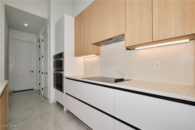 kitchen with marble finish floor, light countertops, light brown cabinets, black electric stovetop, and custom range hood