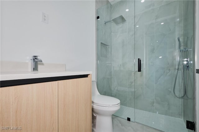 full bathroom with toilet, vanity, and a marble finish shower